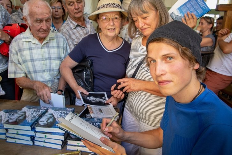 Jost signing books.